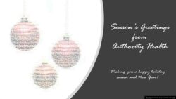 Three festive ornaments with holiday greetings.